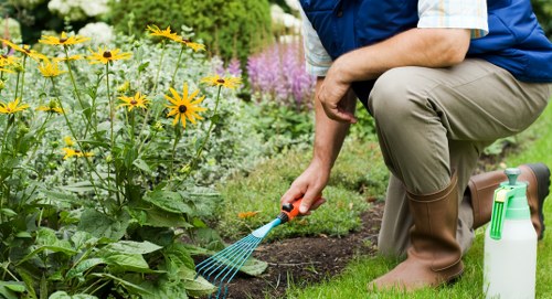Landscape gardening in West Ham with paving, seating, and borders